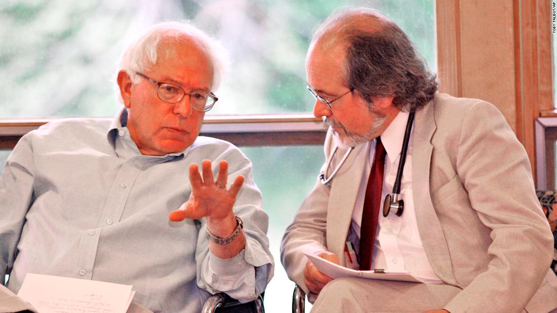 Sanders chats with Dr. John Matthew, director of The Health Center in Plainfield, Vermont, in May 2007. Sanders was in Plainfield to celebrate a new source of federal funding for The Health Center.